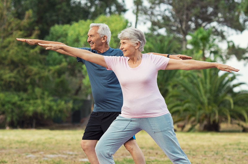 older couple exercising outdoors