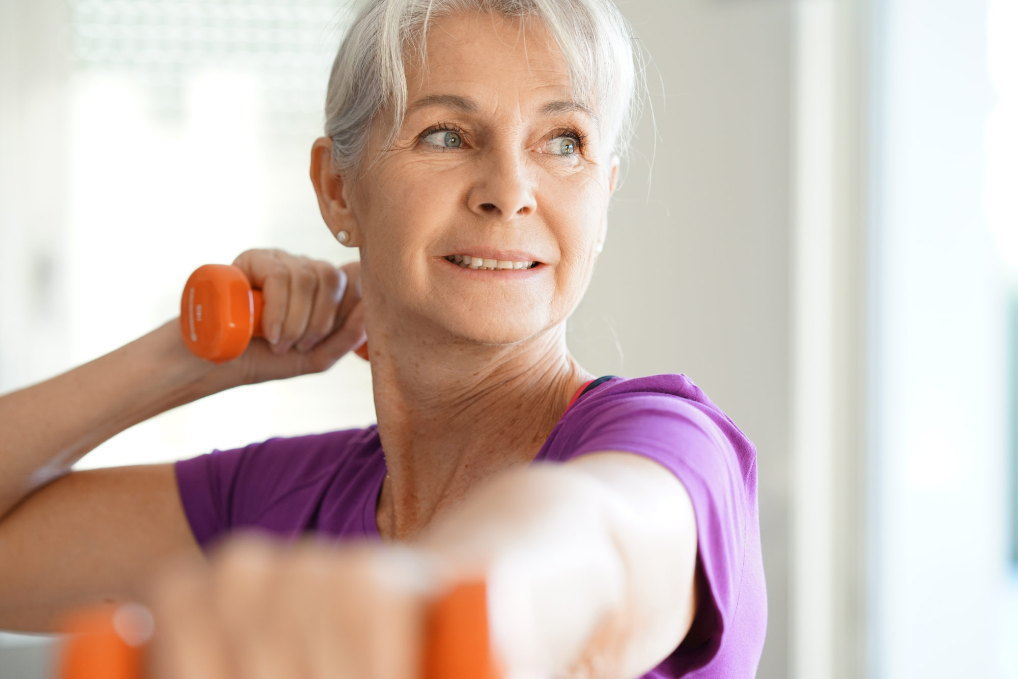 older woman with weights closeup